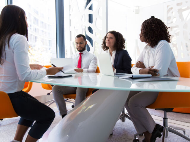 Business leader interviewing job candidate