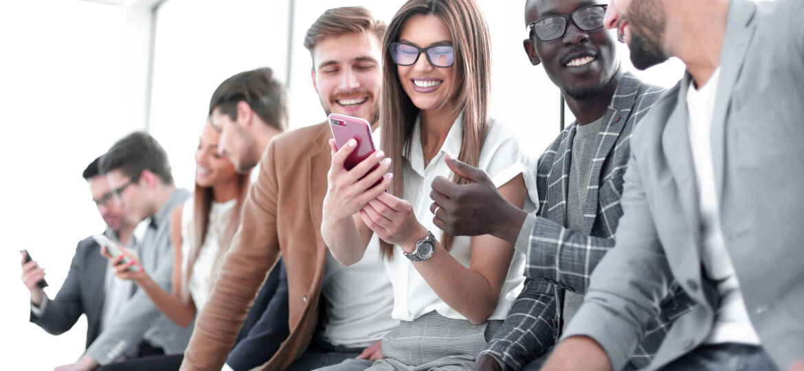 group of young people with smartphones