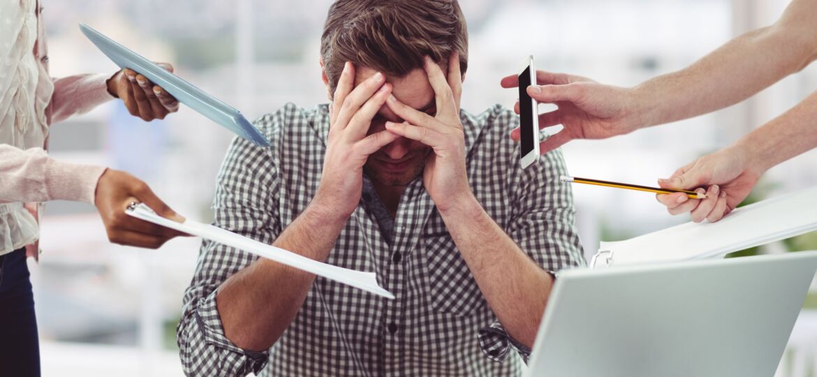 Stressed man frustrated with electronic devices