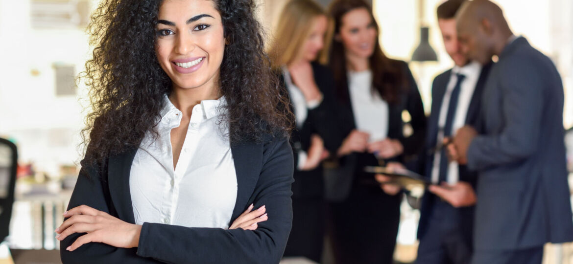 Businesswoman leader in modern office with businesspeople workin