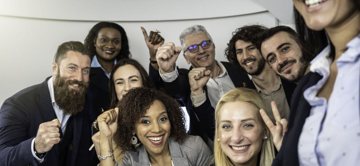 Multiethnic business people taking selfie at business meeting