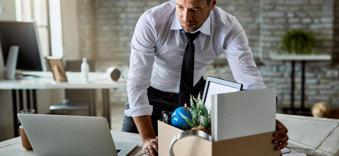 sad-entrepreneur-packing-his-belongings-cardboard-box-while-leaving-office-after-losing-his-job