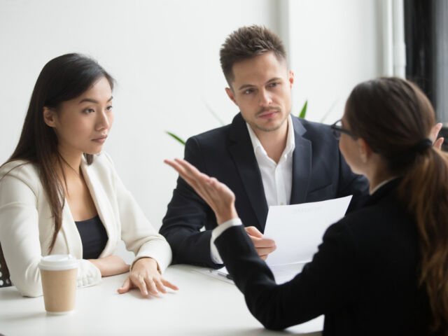 skeptical-diverse-hr-managers-interviewing-female-applicant-bad-first-impression