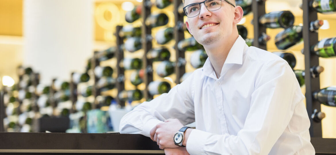 smiling-portrait-handsome-young-man-sitting-bar