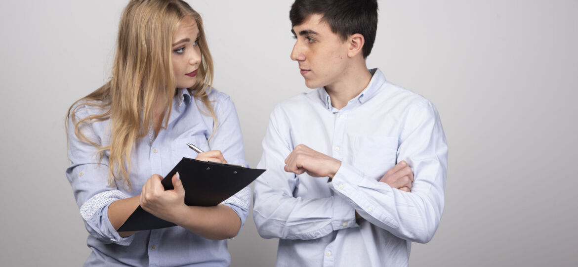 young-business-couple-discussing-about-work-related-stuff