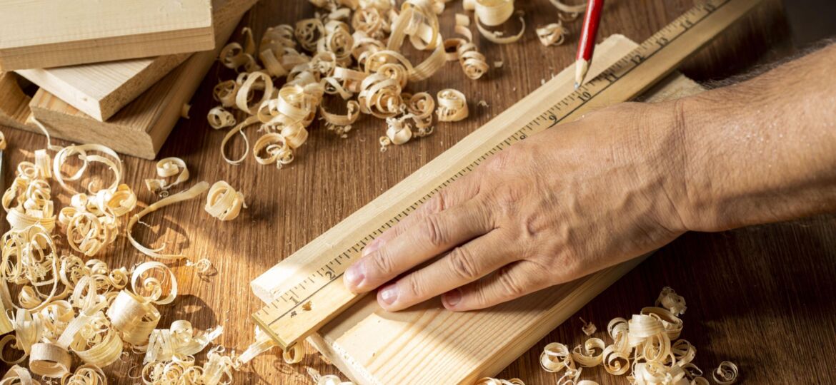 carpenter-working-piece-wood-with-pencil