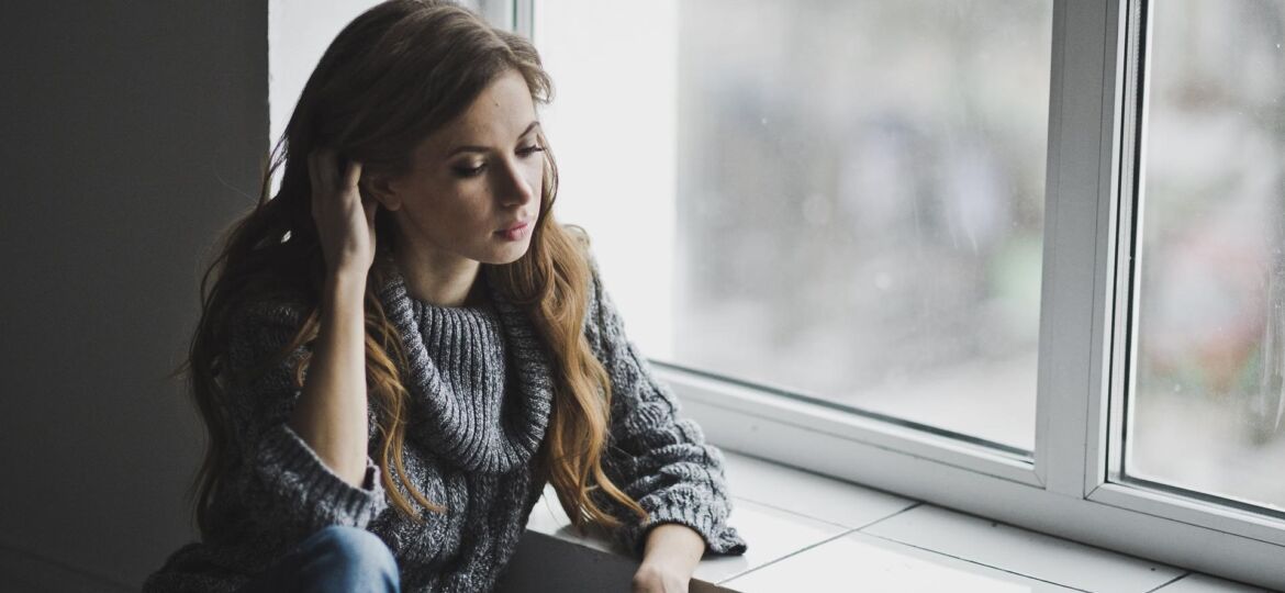 Young college graduate depressed because she is underemployed