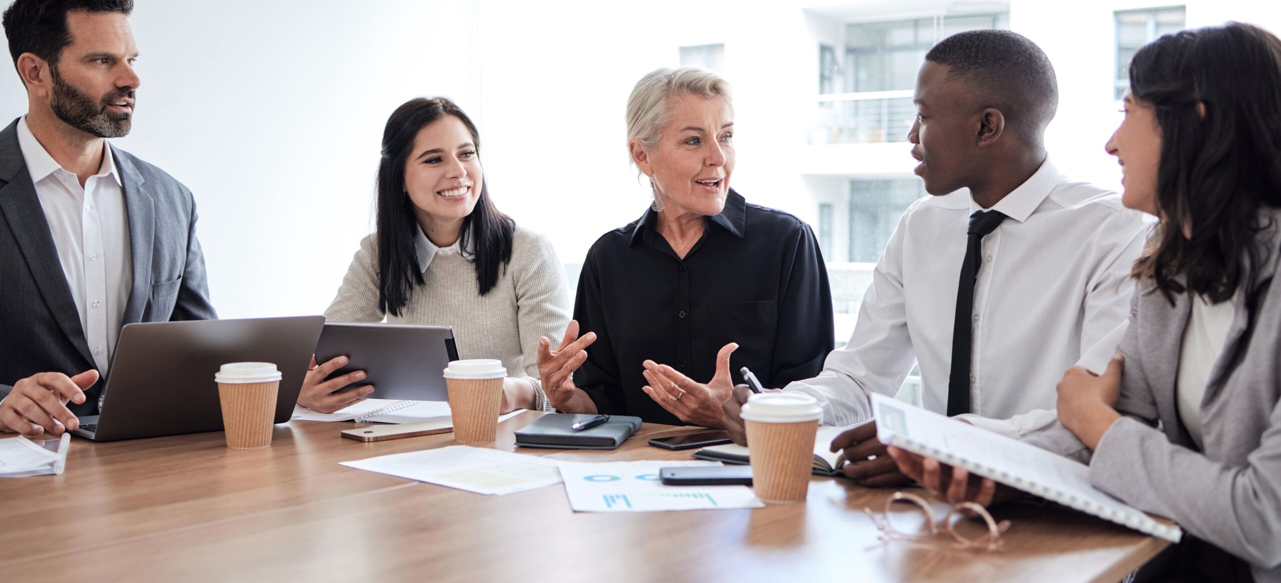 Diverse professional team discussing workplace engagement strategy