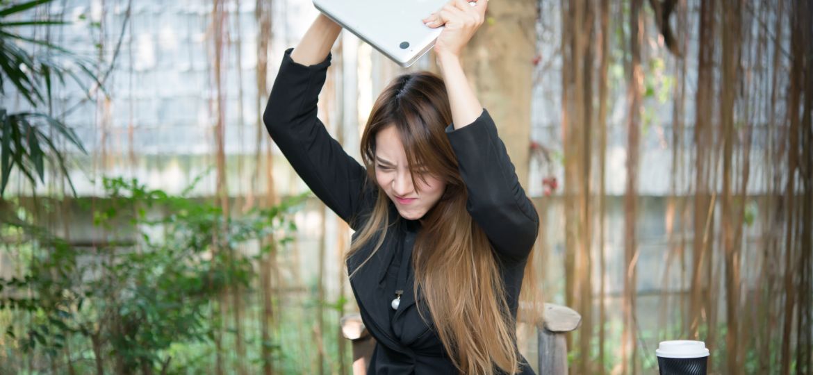 Business Woman getting crazy with of her laptop.