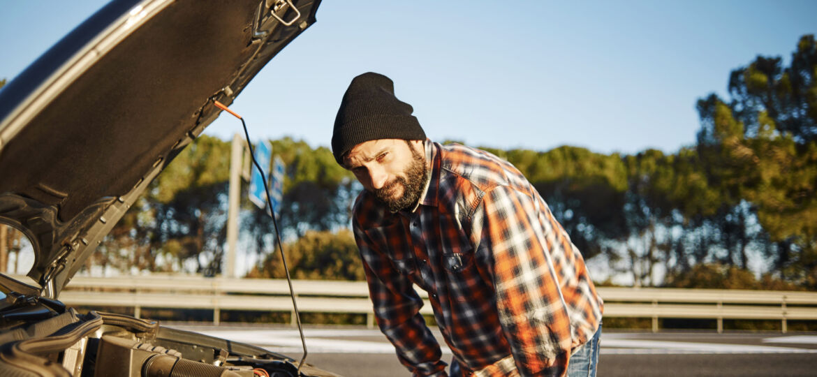 Car - young male model stands a careful look face and looking at