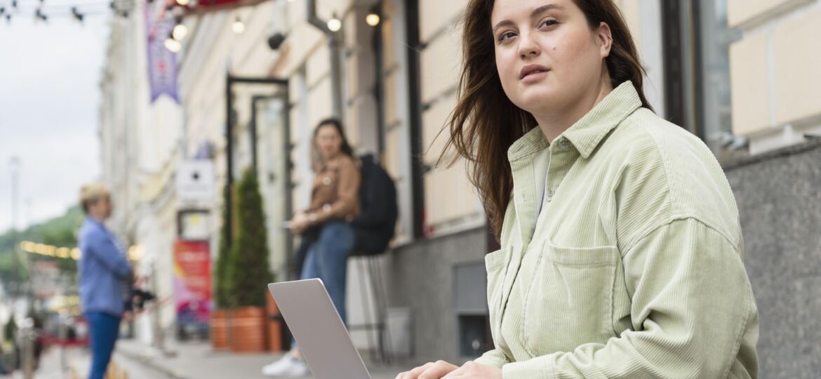 medium-shot-woman-working-laptop