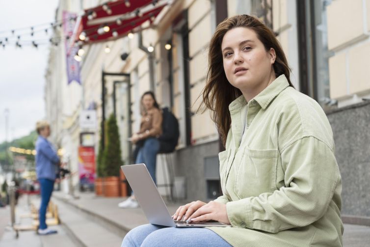 medium-shot-woman-working-laptop