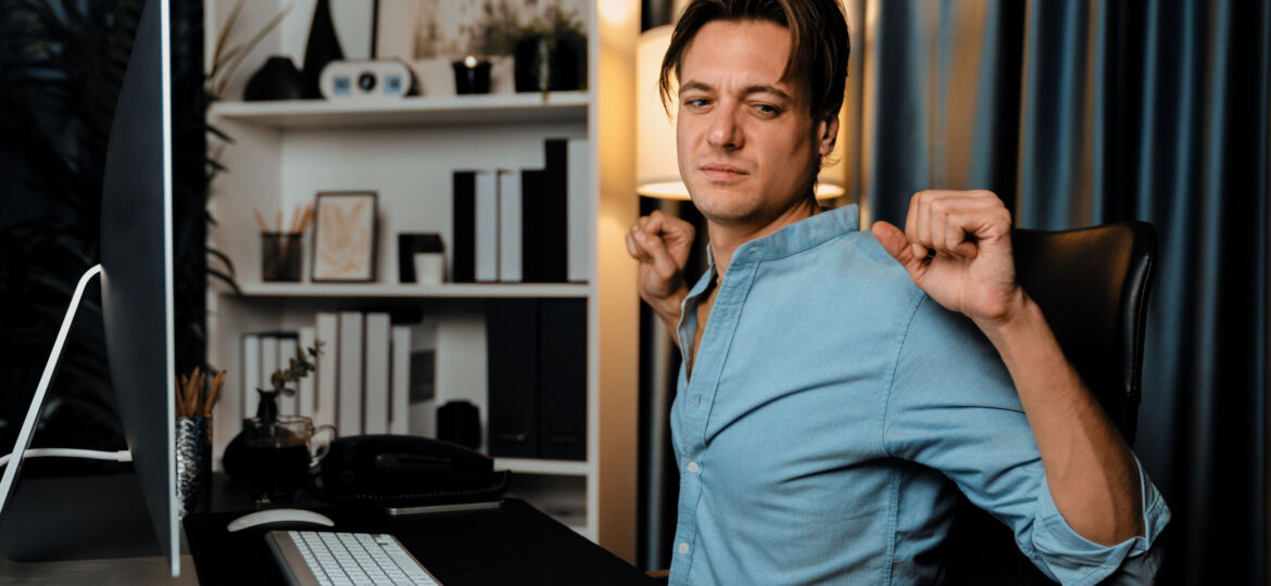 Sales manager working with stretching manner in working at night. Pecuniary.