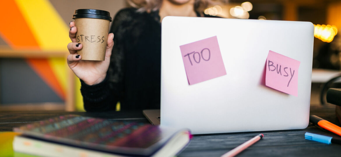young woman working on laptop in co-working office