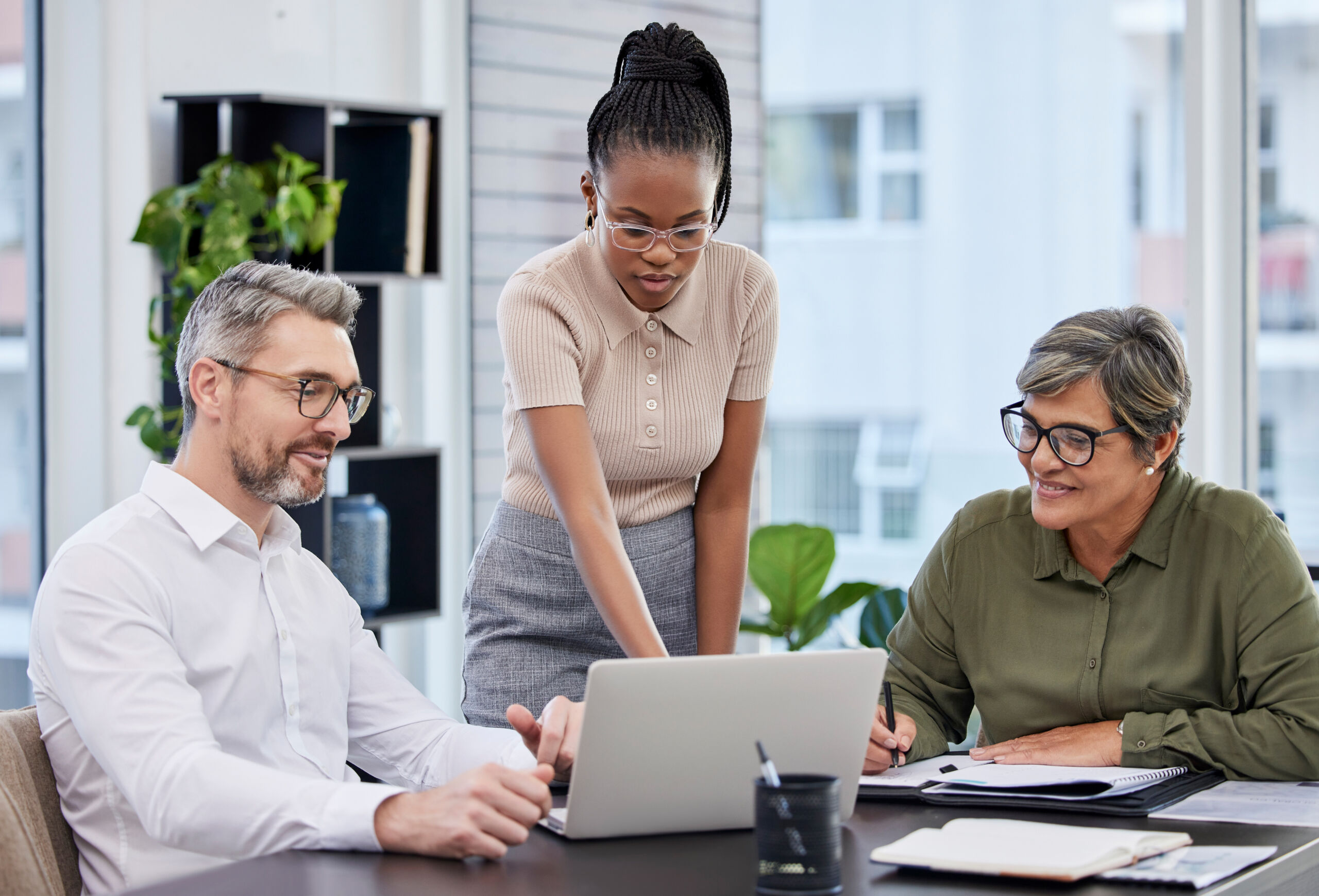 Businesswoman presenting workplace improvement ideas to her team