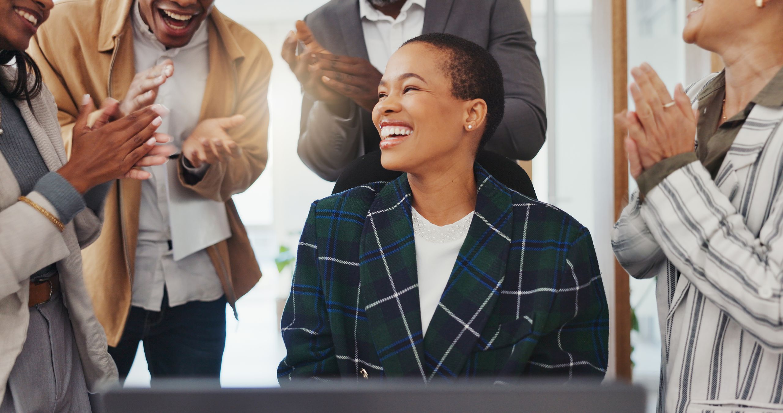 Employees celebrating workplace success and recognition
