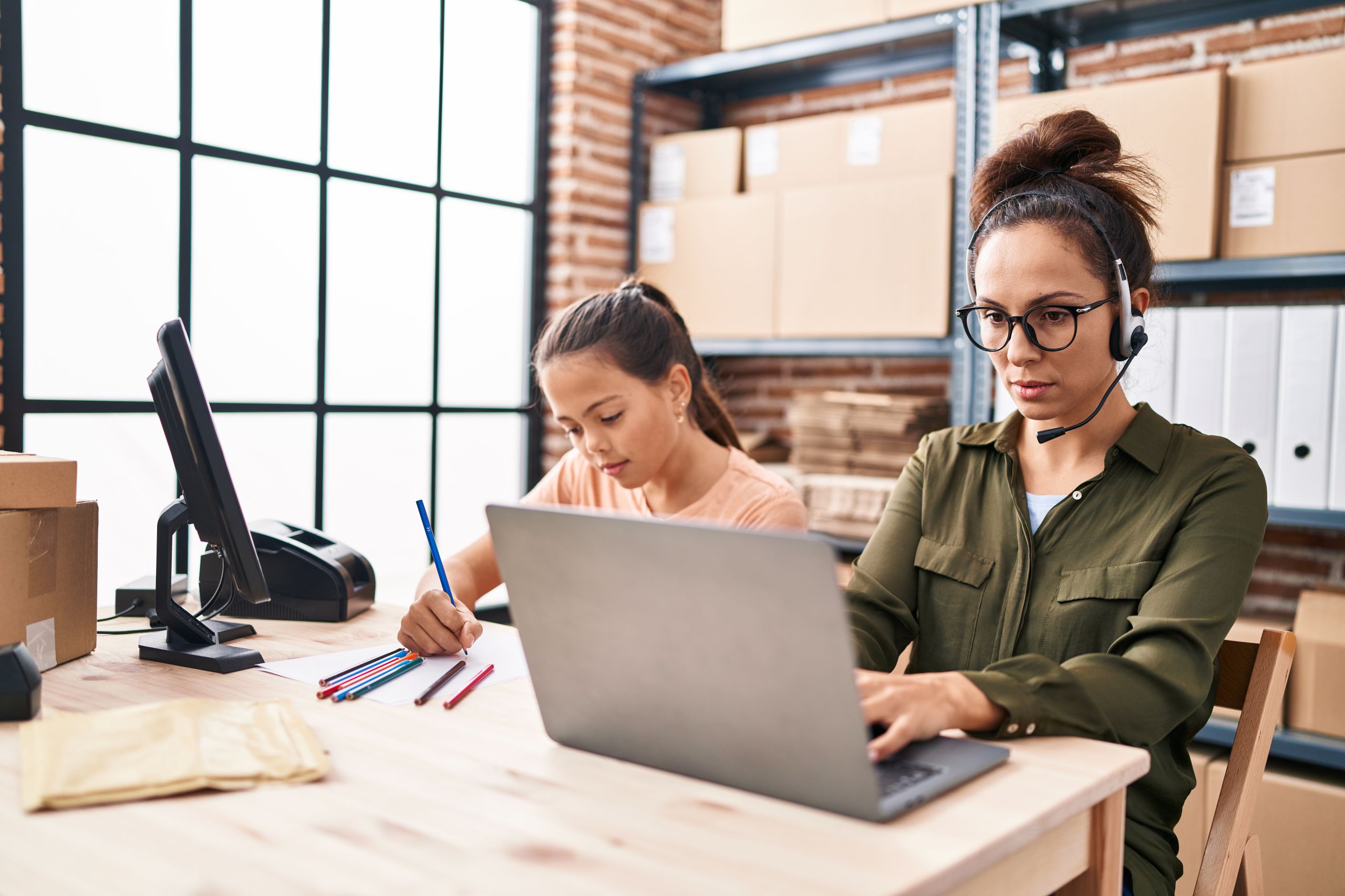 Employee working thoughtfully in an office setting during workplace culture planning
