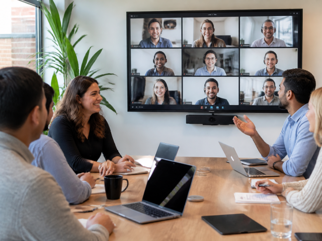 magnific_a-hybrid-team-meeting-wit_u5kGvIEQLD
