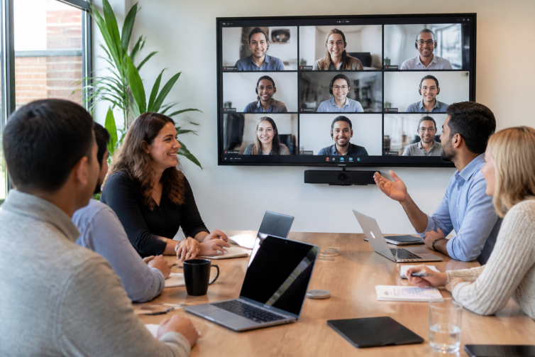 magnific_a-hybrid-team-meeting-wit_u5kGvIEQLD